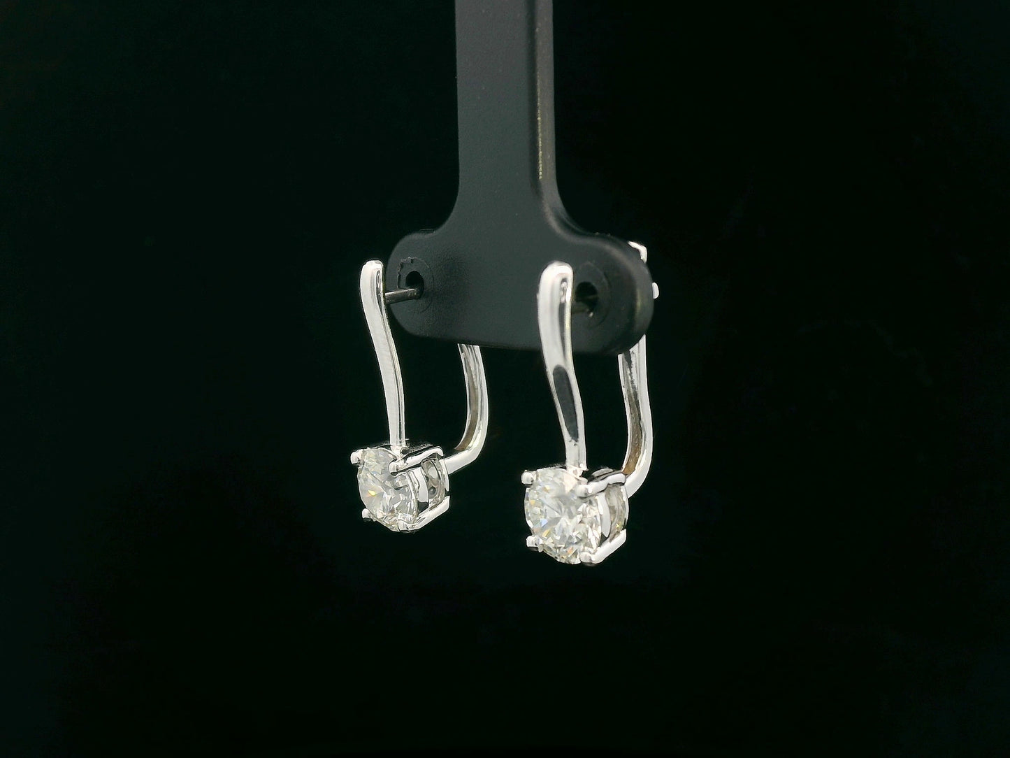 18K white gold diamond drop earrings with 1.01ct and 1.02ct round-cut GIA-certified diamonds in four-prong setting