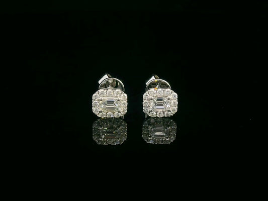 18K gold emerald-cut diamond halo stud earrings with round diamond accents, screw-back style on black background.