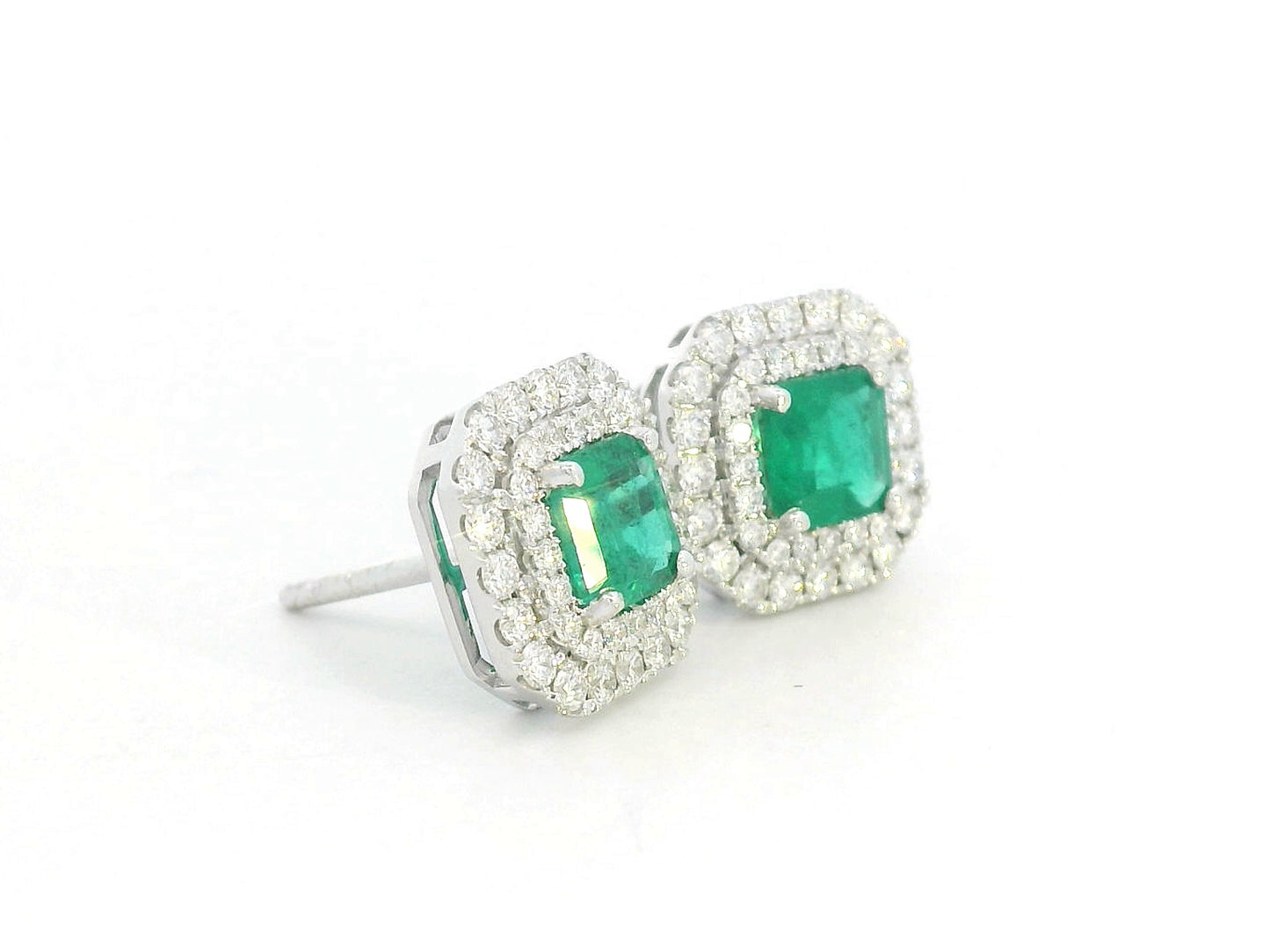 Square-cut emerald stud earrings with double diamond halo in 18K white gold – 1.19ct emeralds and 0.65ct diamonds