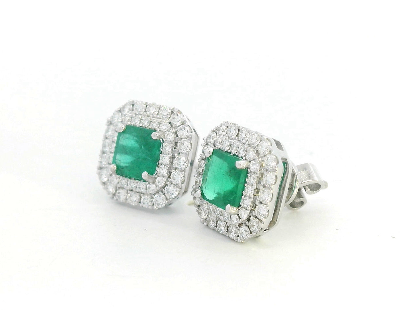 Square-cut emerald stud earrings with double diamond halo in 18K white gold – 1.19ct emeralds and 0.65ct diamonds