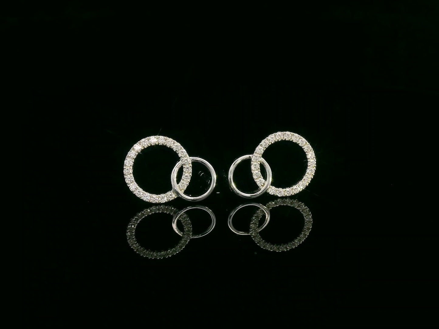 18K gold interlinked diamond circle stud earrings with 0.27 carats of round diamonds.