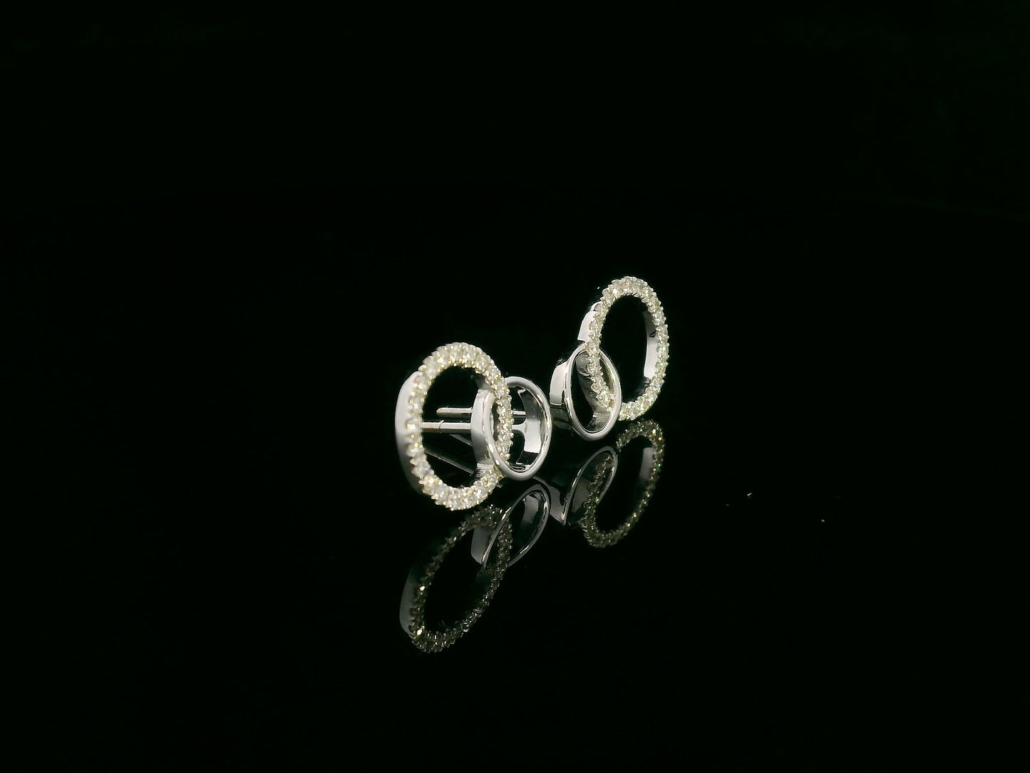 18K gold interlinked diamond circle stud earrings with 0.27 carats of round diamonds.