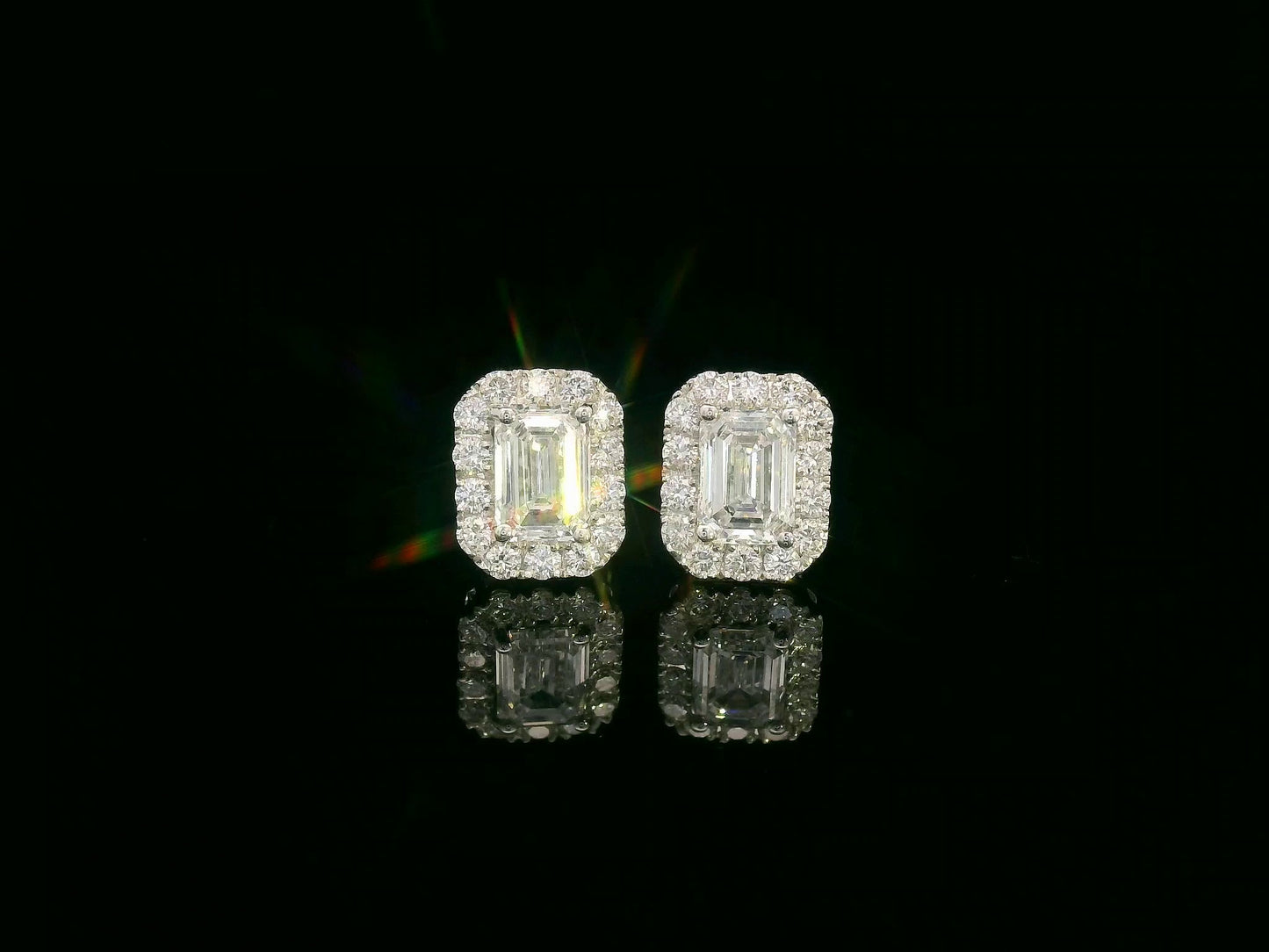 18K white gold emerald-cut diamond halo stud earrings with 1.04ct GIA diamonds and 0.35ct halo accents