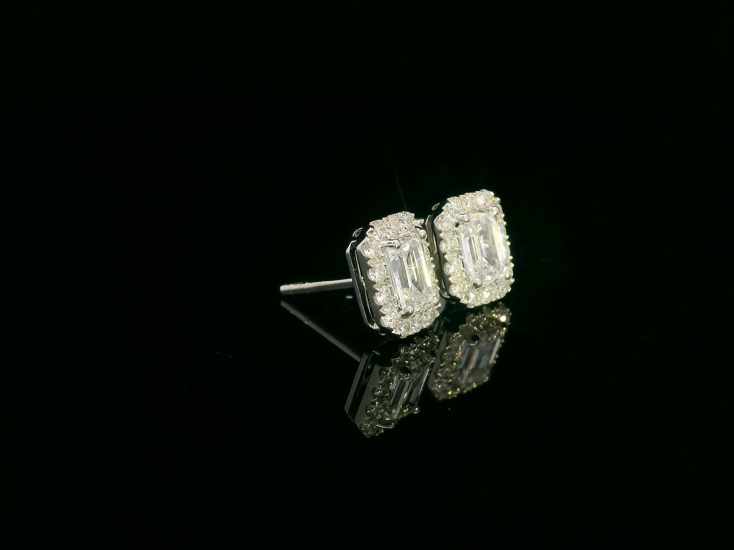 18K white gold emerald-cut diamond halo stud earrings with 1.04ct GIA diamonds and 0.35ct halo accents