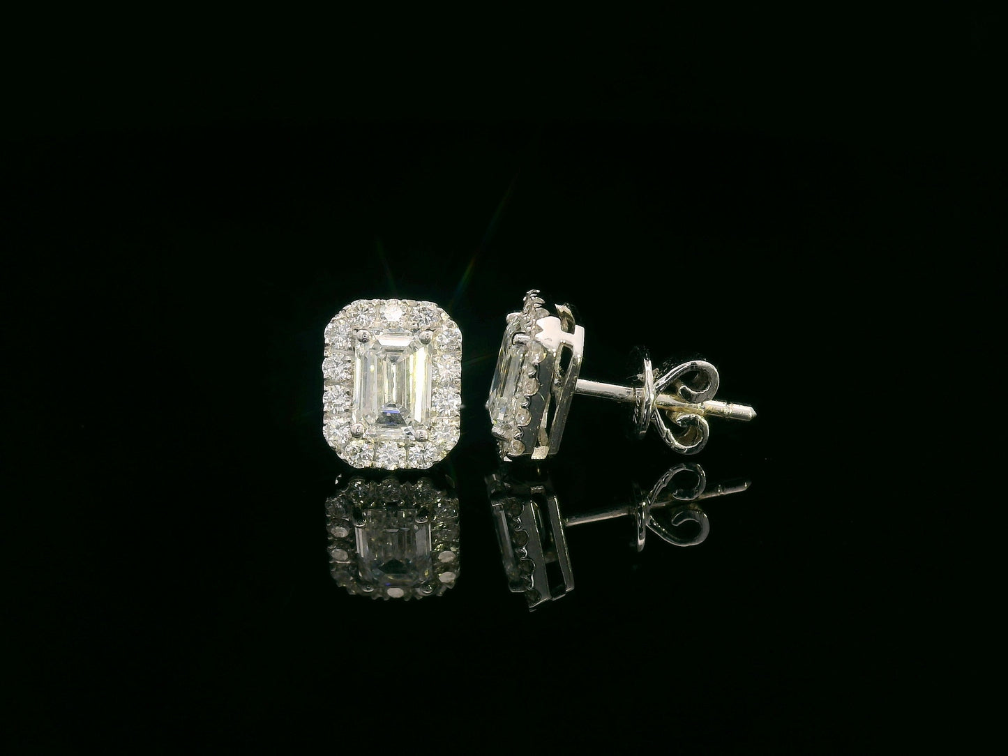 18K white gold emerald-cut diamond halo stud earrings with 1.04ct GIA diamonds and 0.35ct halo accents