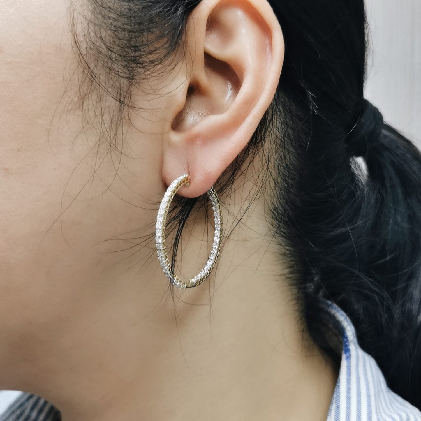 18K yellow gold inside-out diamond hoop earrings with 2.46 carats of round brilliant diamonds