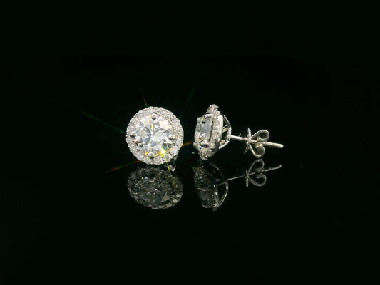 18K white gold diamond stud earrings with 1.01ct and 1.02ct round diamonds and halo totaling 0.33 carats