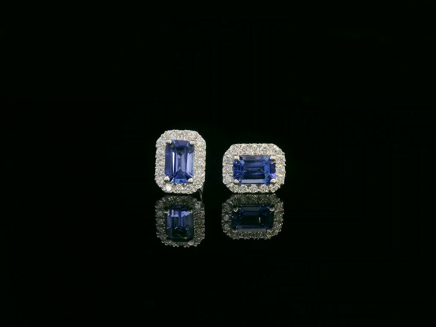 Emerald-cut Tanzanite and diamond halo stud earrings in 18K white gold