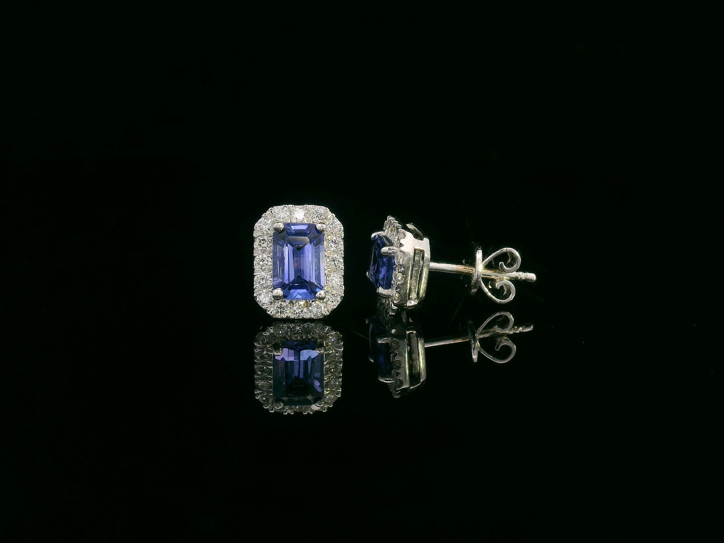 Emerald-cut Tanzanite and diamond halo stud earrings in 18K white gold