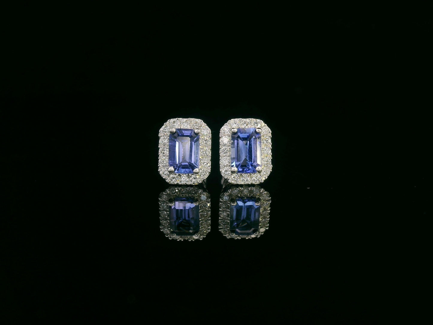Emerald-cut Tanzanite and diamond halo stud earrings in 18K white gold