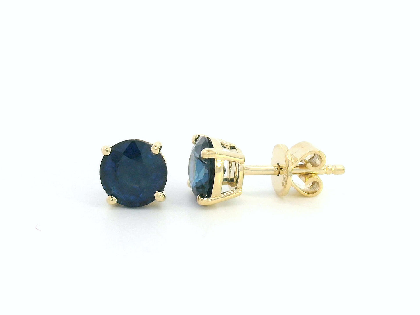 Round cut diffuse blue sapphire solitaire stud earrings in 18K yellow gold with butterfly backs