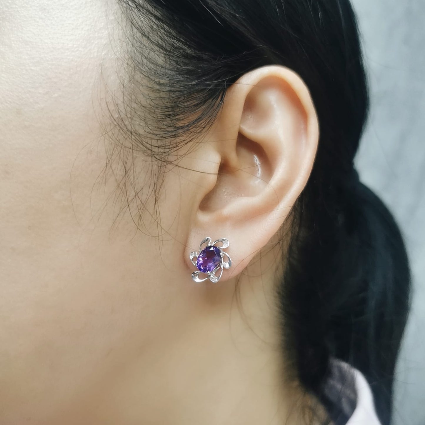 18K white gold amethyst stud earrings with oval purple gemstones and diamond halo in floral setting, elegant fine jewelry