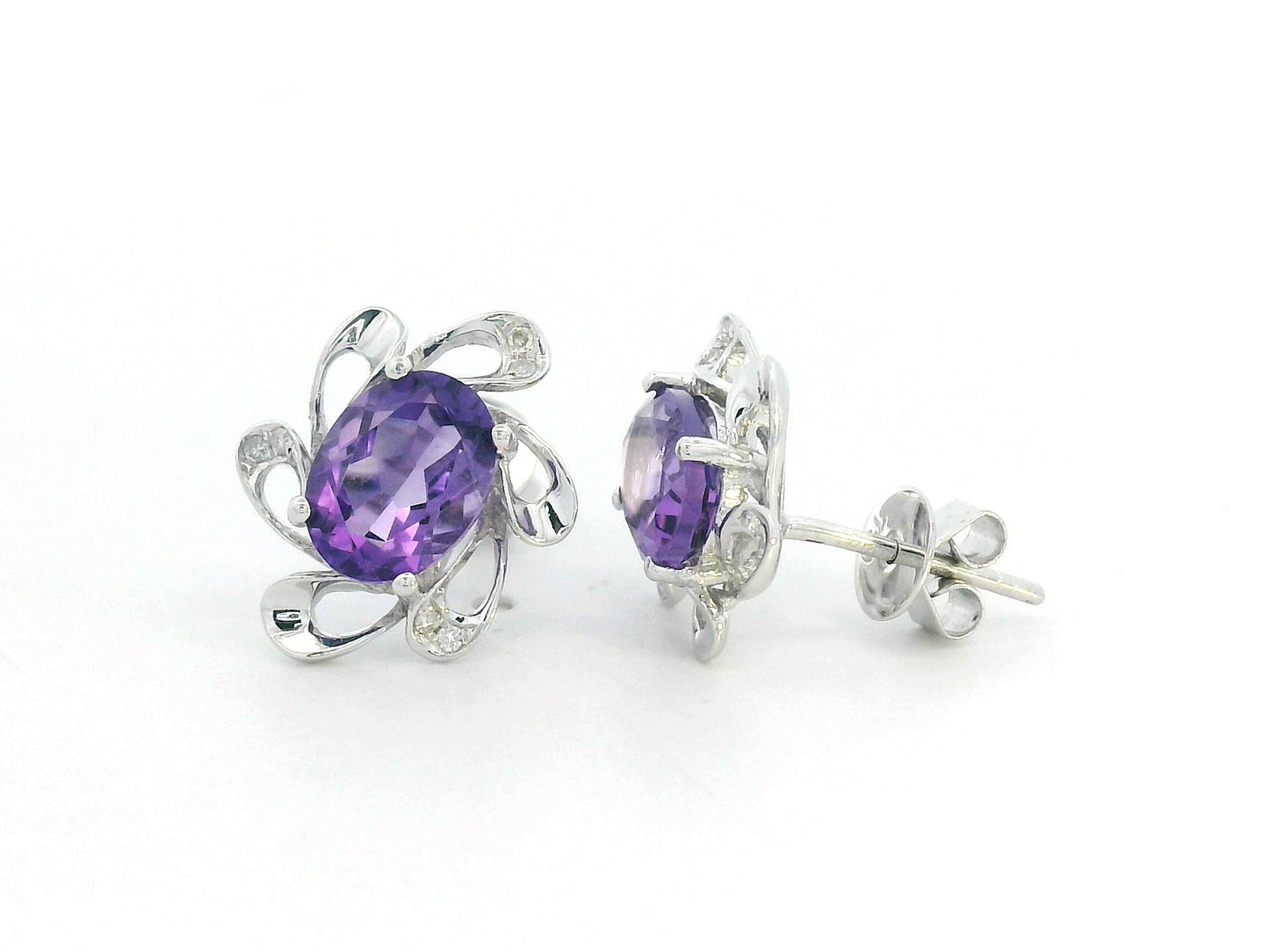 Purple amethyst earrings with diamond accents in white gold, elegant floral setting