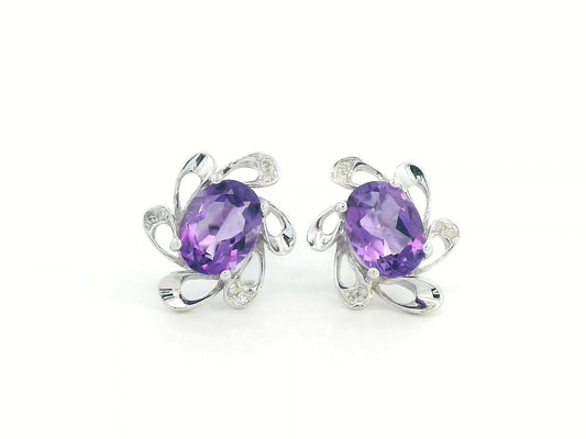 Oval amethyst and diamond halo earrings in 18K white gold, floral-inspired stud design