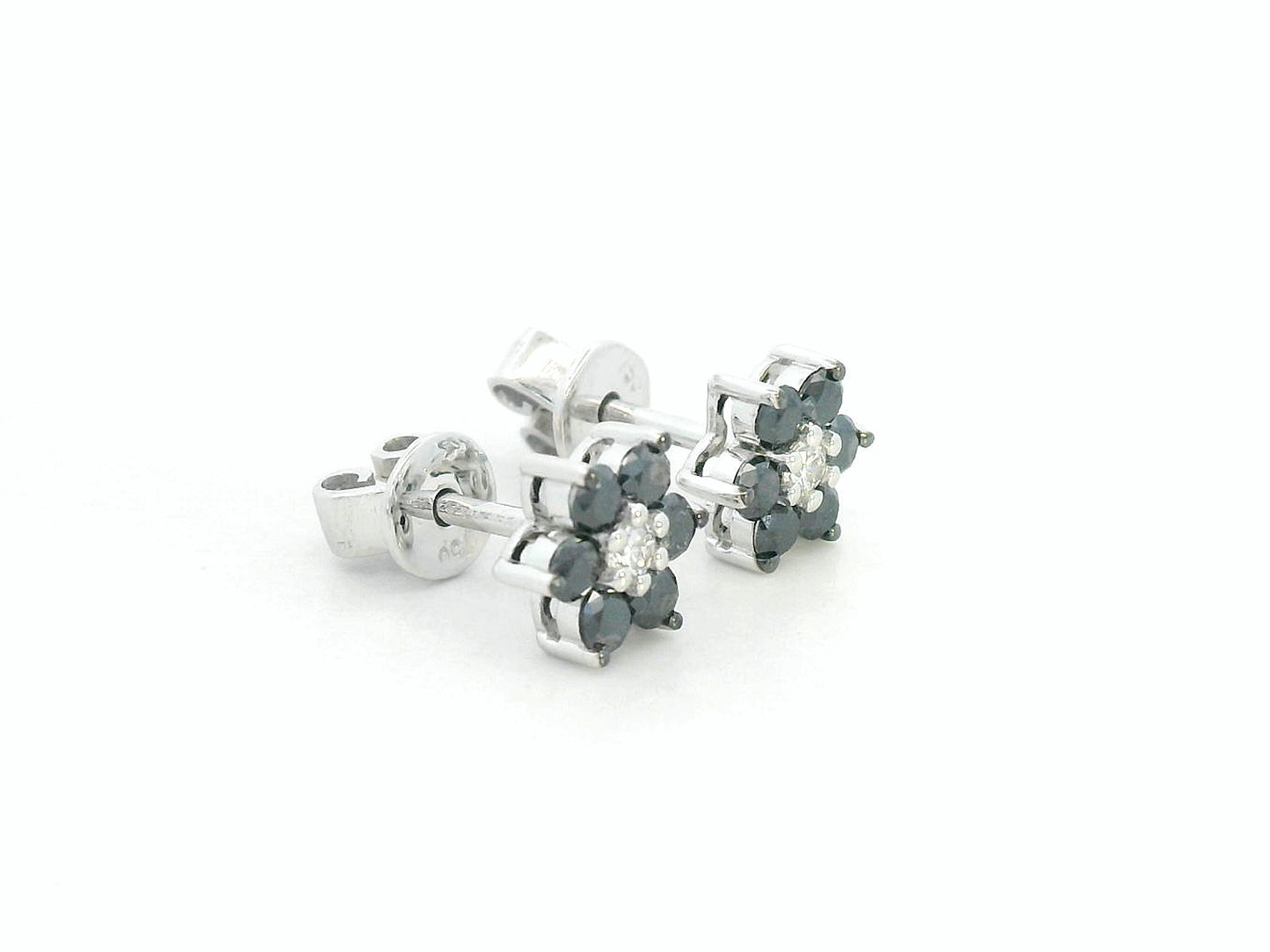 Bold black and white diamond earrings in a floral design