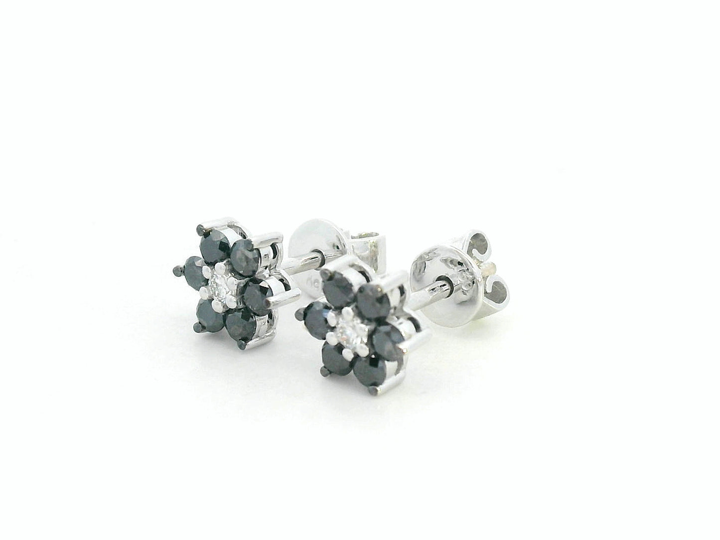 Bold black and white diamond earrings in a floral design