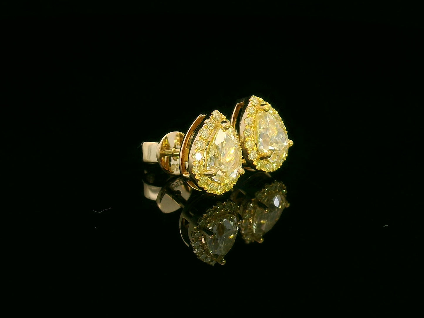 18K yellow gold halo stud earrings with pear-shaped fancy yellow diamonds