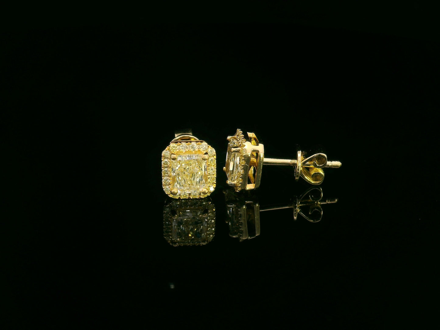 Radiant-cut fancy yellow diamond halo earrings in 18K yellow gold