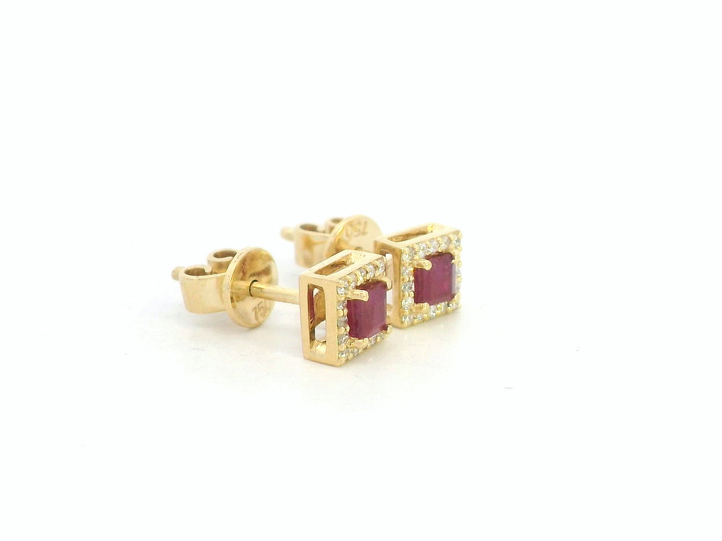 Ruby center with diamond halo detail, fine craftsmanship in 18K gold