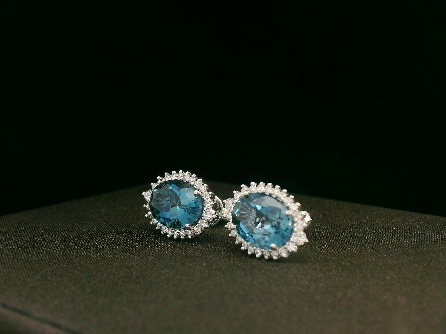18k white gold London Blue Topaz and diamond halo earrings