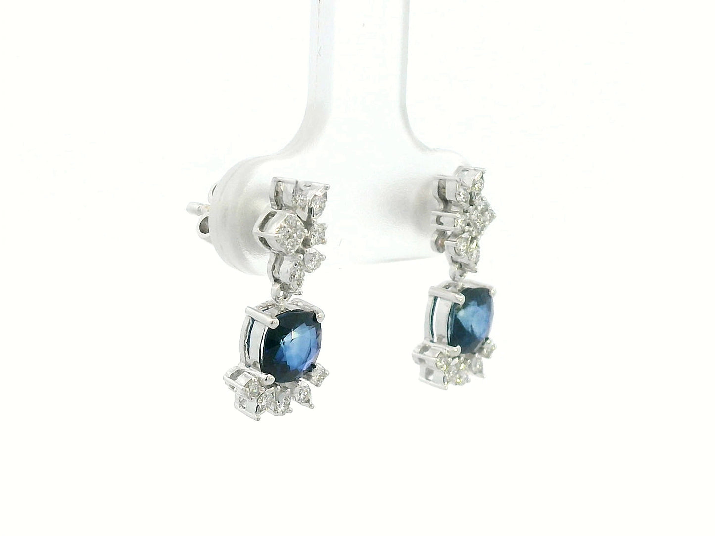 Side view showing elegant drop design and diamond clusters