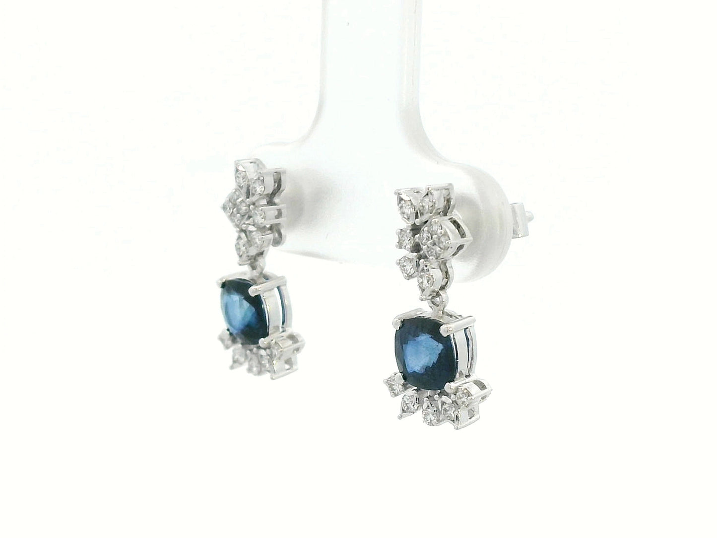 Side view showing elegant drop design and diamond clusters