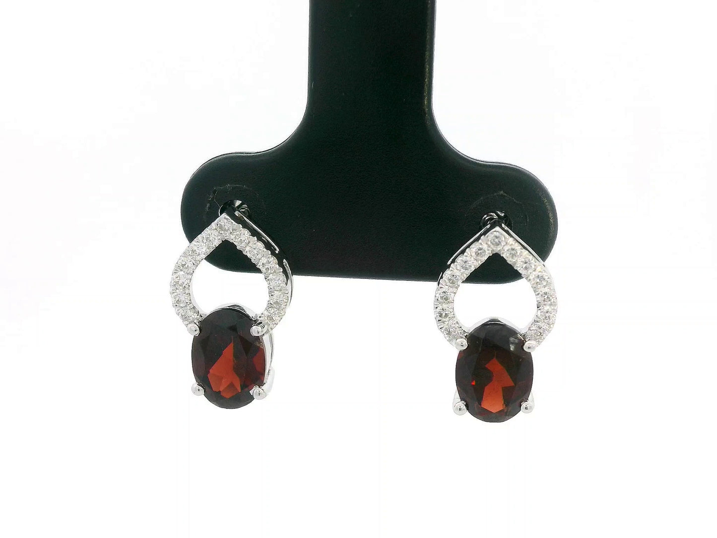 18k white gold stud earrings with oval garnets totaling 1.92 carat and 0.18 carat diamonds in open teardrop design