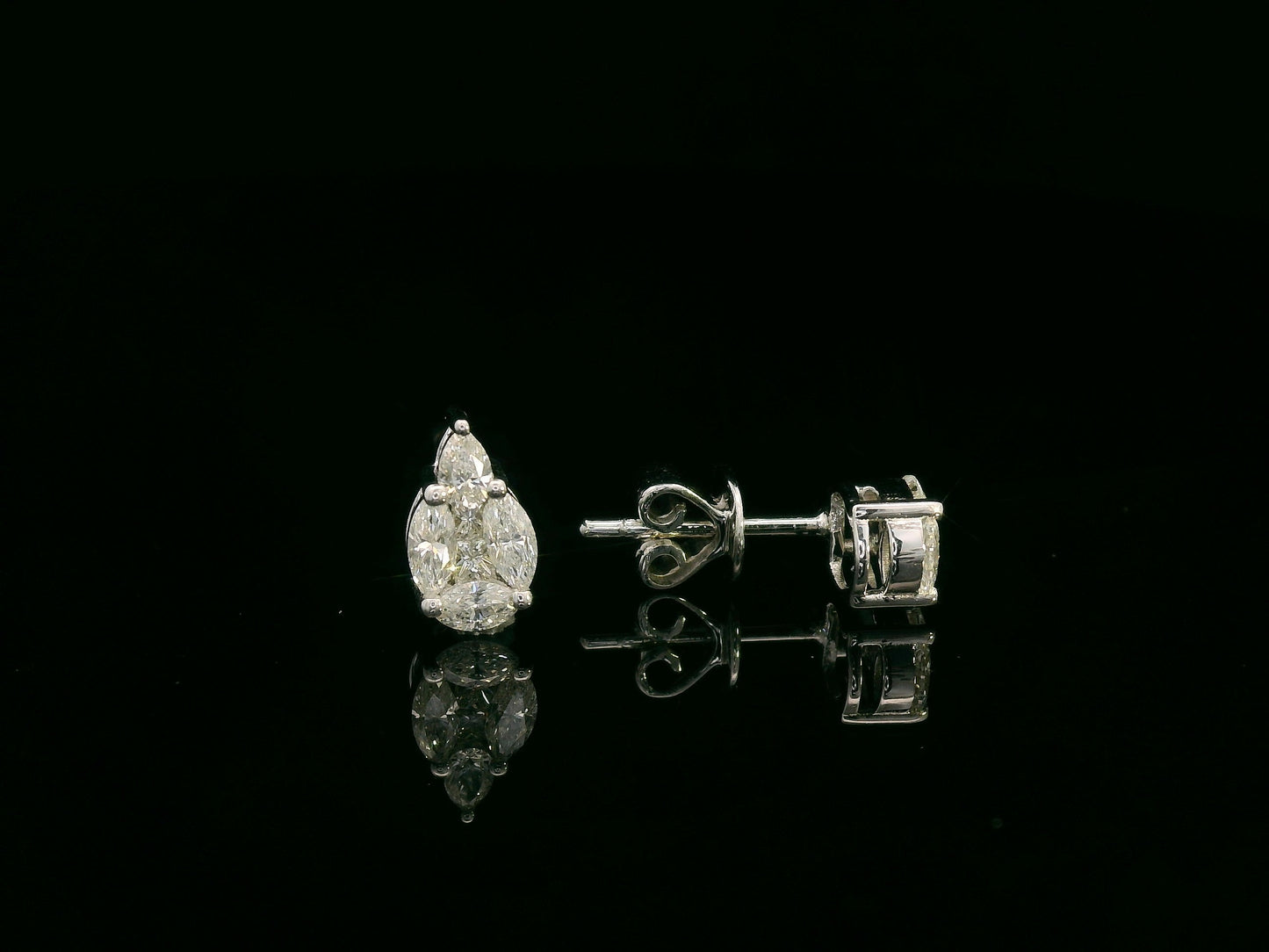 Front view of 18k white gold stud earrings with pear, marquise, and princess-cut diamond cluster