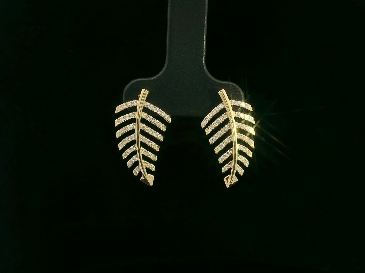 18K yellow gold leaf-shaped stud earrings with pavé diamonds, nature-inspired elegant design