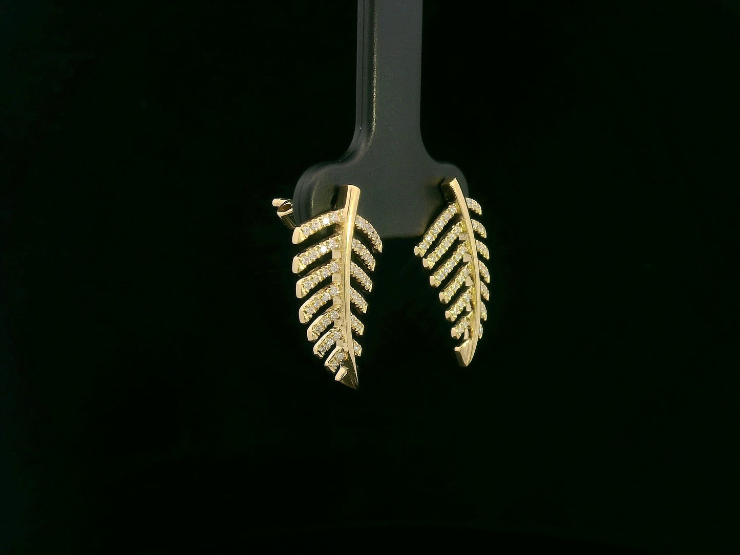 18K yellow gold leaf-shaped stud earrings with pavé diamonds, nature-inspired elegant design
