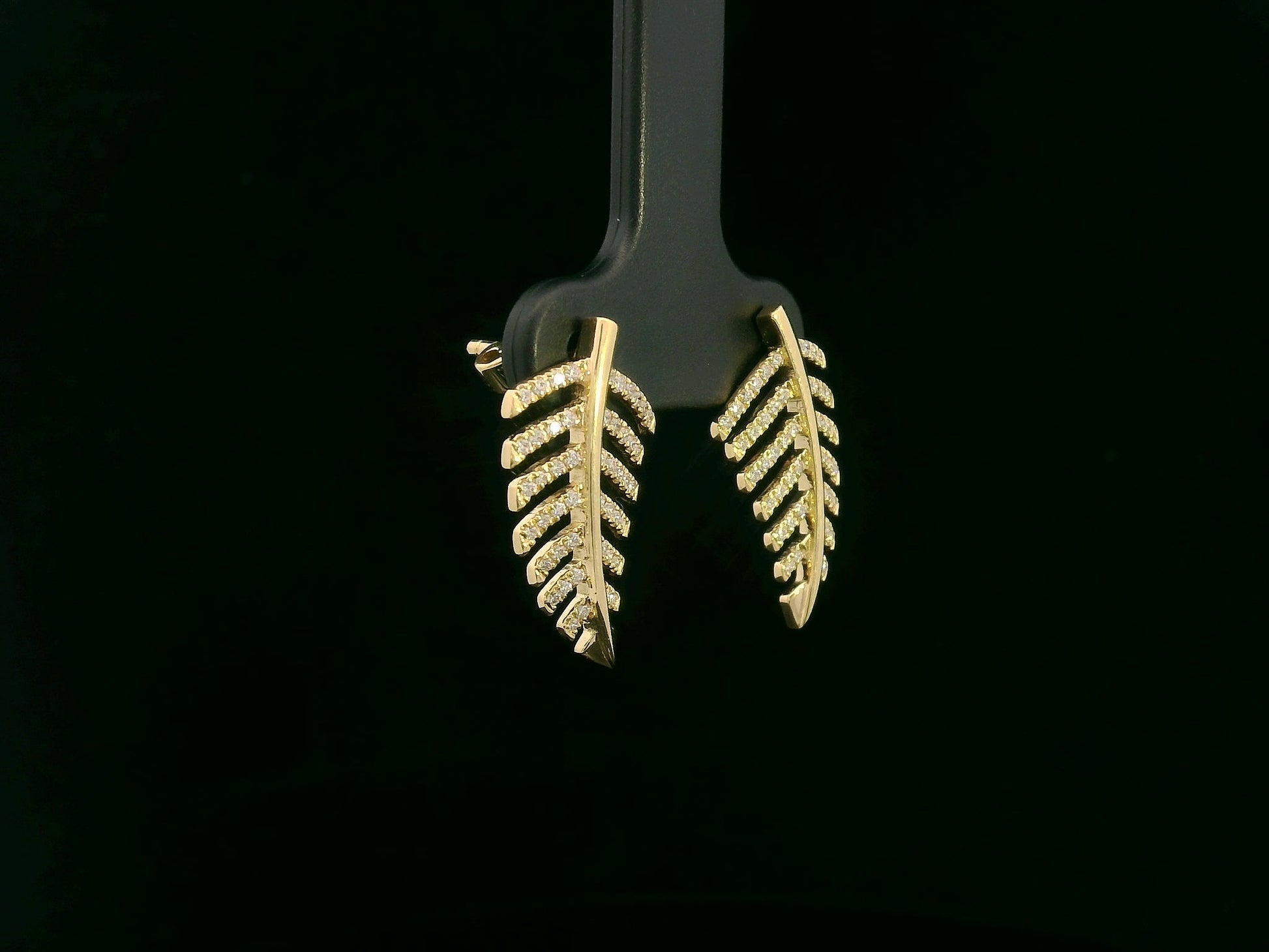 18K yellow gold leaf-shaped stud earrings with pavé diamonds, nature-inspired elegant design