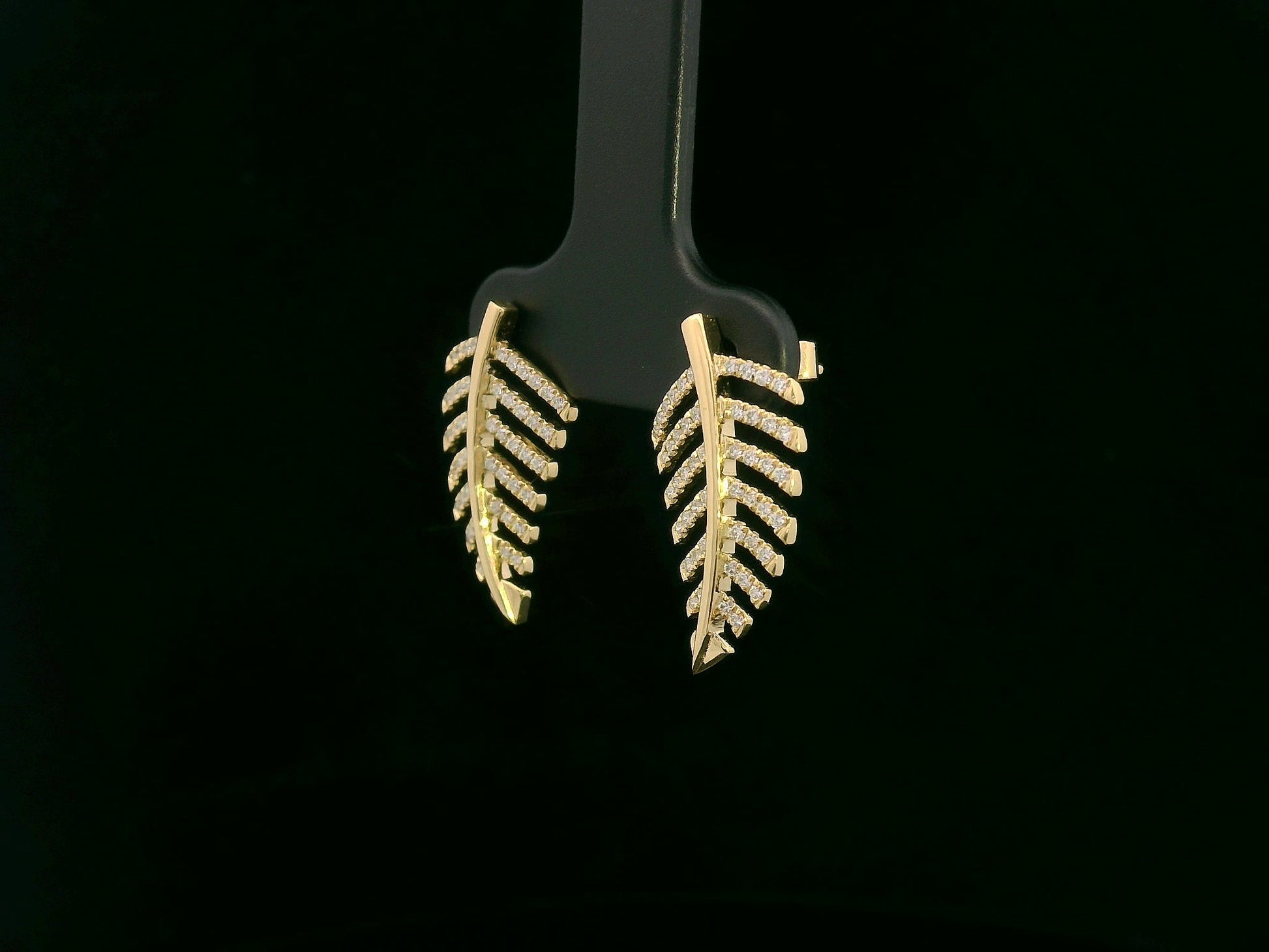 18K yellow gold leaf-shaped stud earrings with pavé diamonds, nature-inspired elegant design