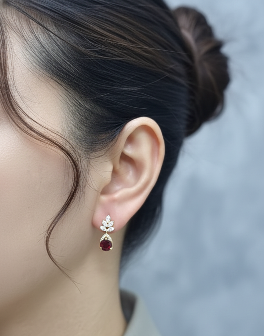 18K yellow gold leaf earrings with a toatl of 1.93ct round cut  garnets and 0.41ct pavé diamonds