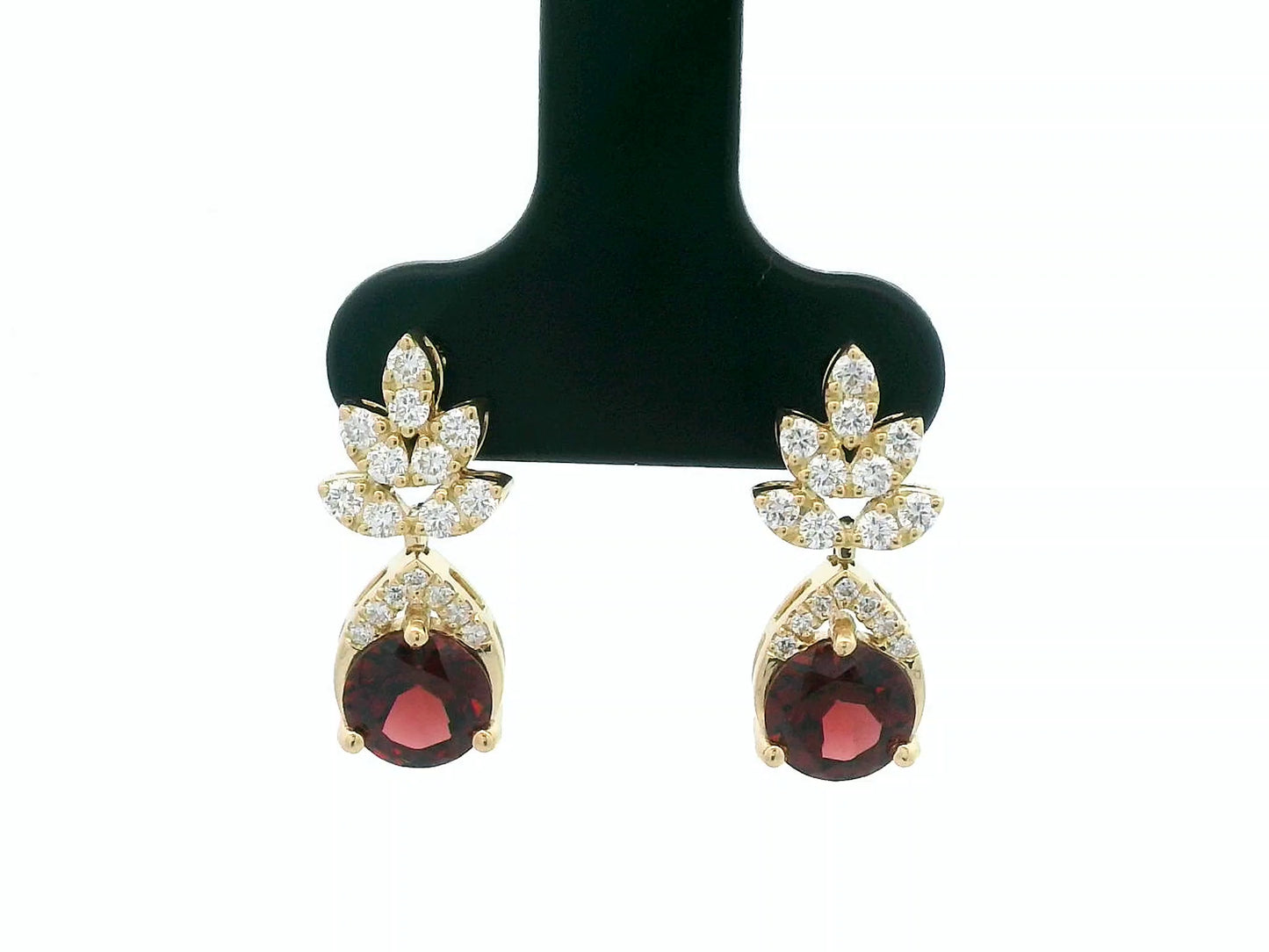 18K yellow gold leaf earrings with a toatl of 1.93ct round cut  garnets and 0.41ct pavé diamonds