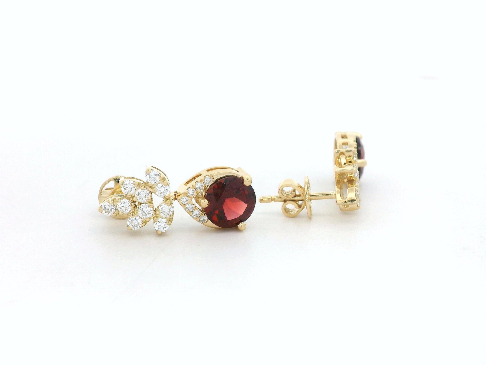 18K yellow gold leaf earrings with a toatl of 1.93ct round cut  garnets and 0.41ct pavé diamonds