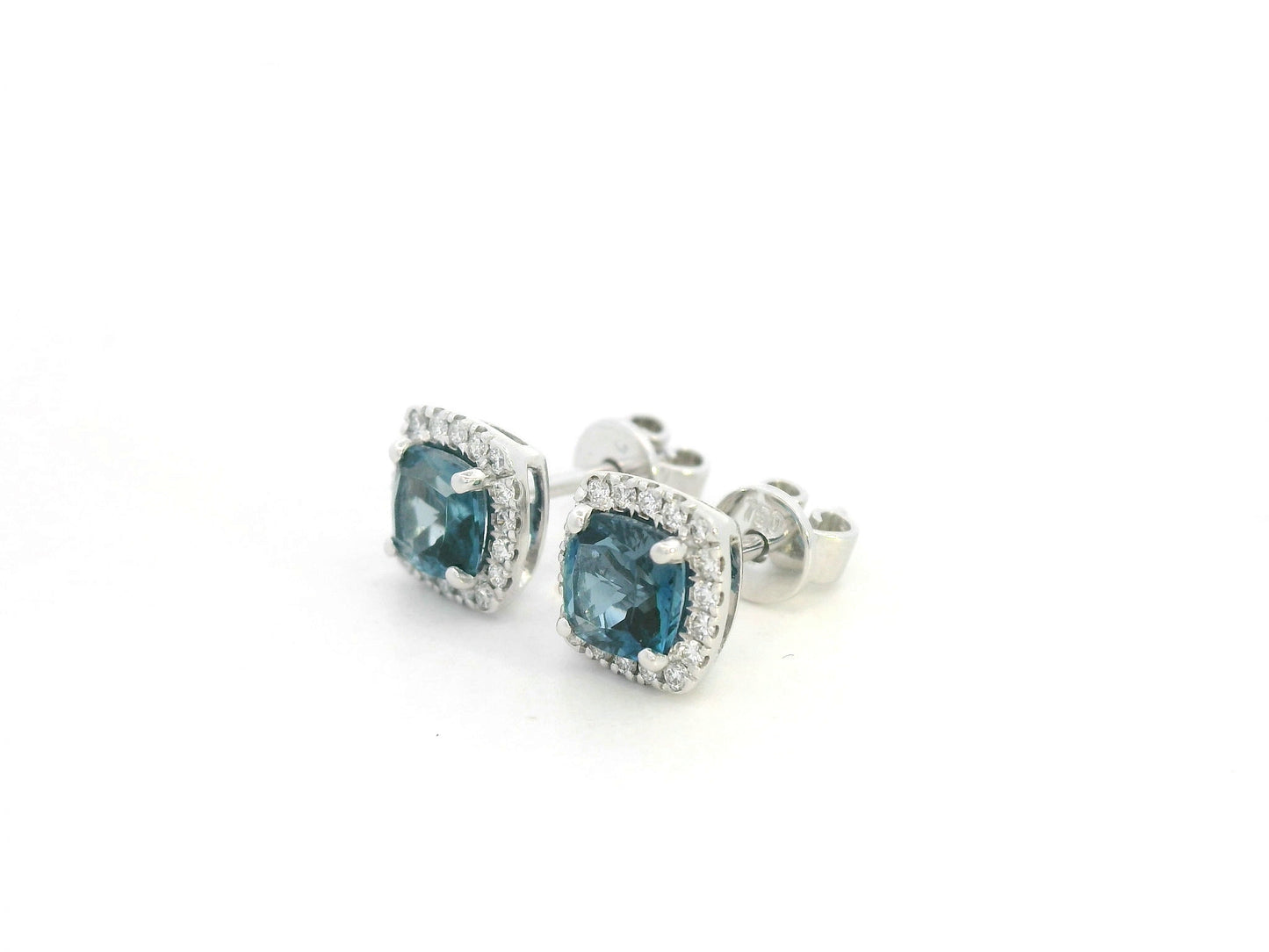 18K white gold blue topaz and diamond halo stud earrings by Emirates Diamonds