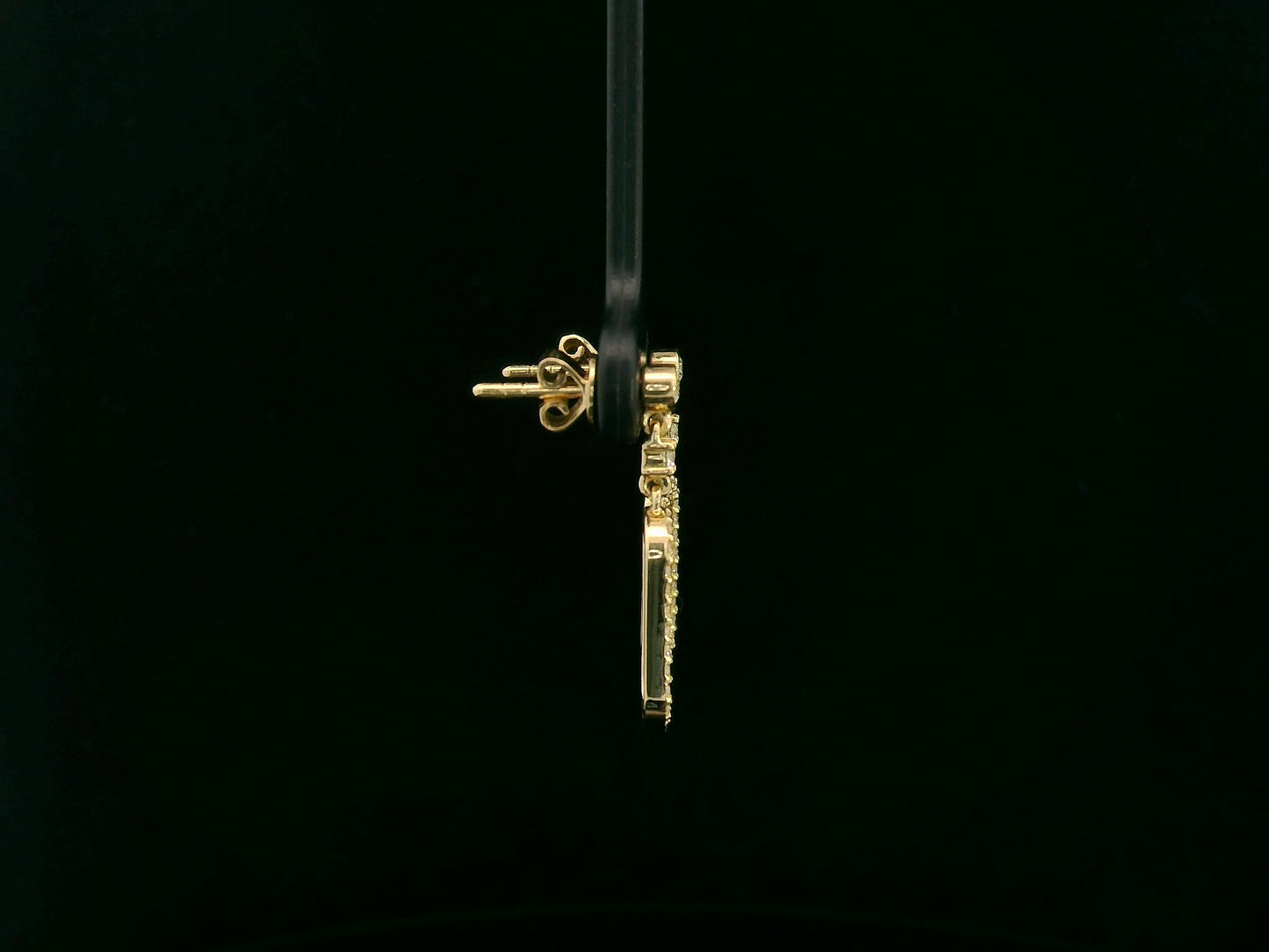 18K yellow gold diamond drop earrings featuring an elongated pavé-set oval design by Emirates Diamonds.