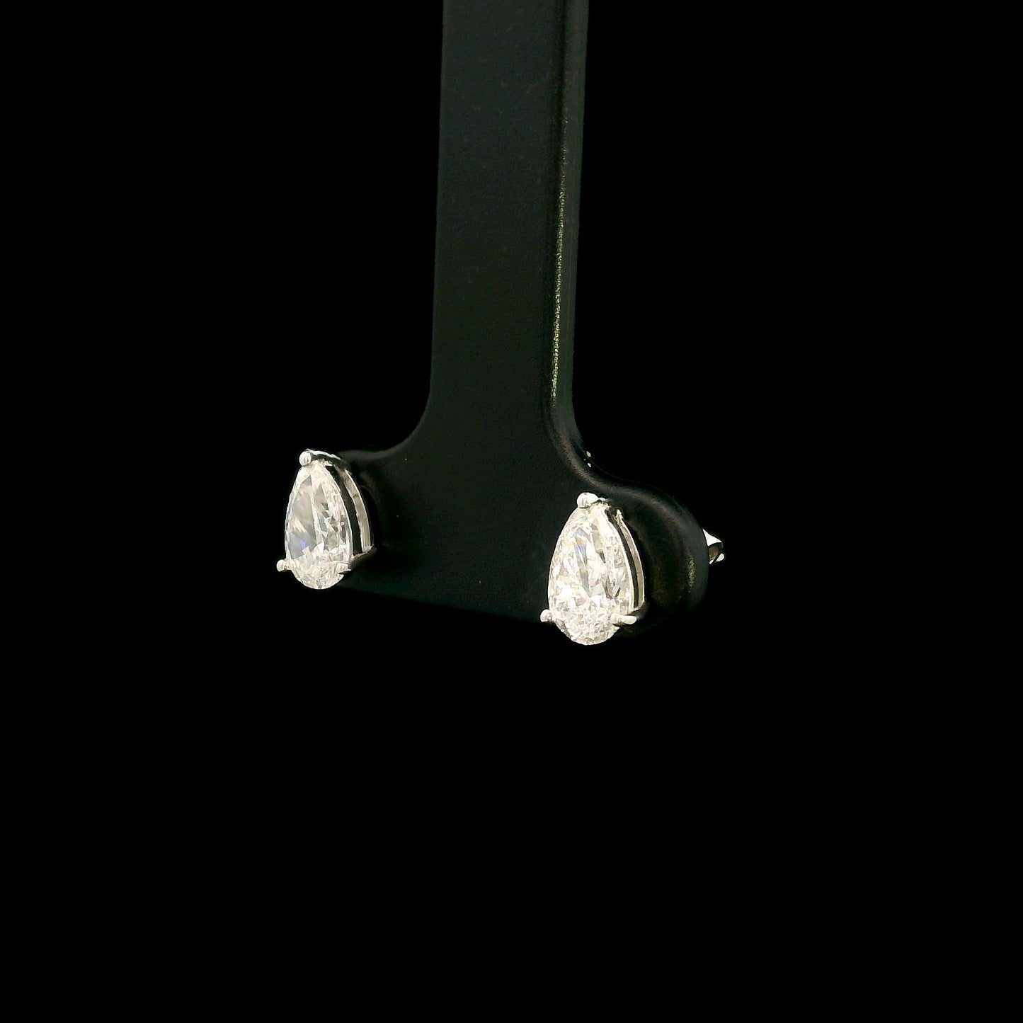 GIA certified pear shape diamond stud earrings in 18K white gold with two 0.50 carat D colour VS1 natural diamonds