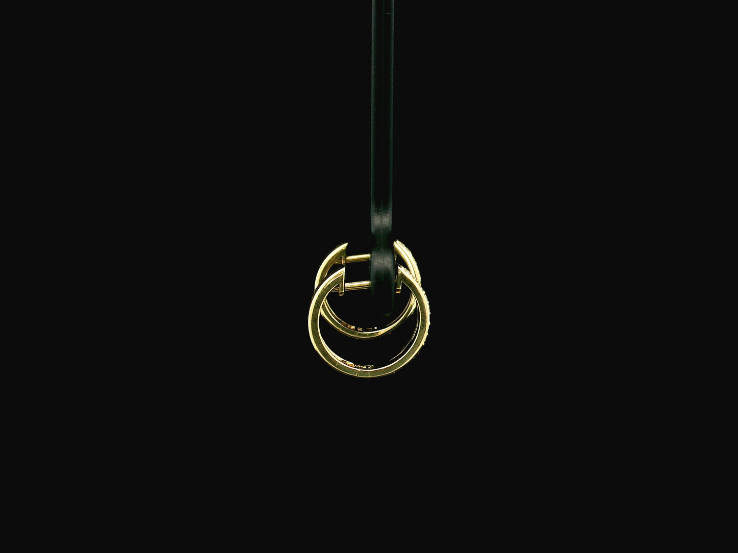 Small diamond huggie hoop earrings in 18K yellow gold by Emirates Diamonds