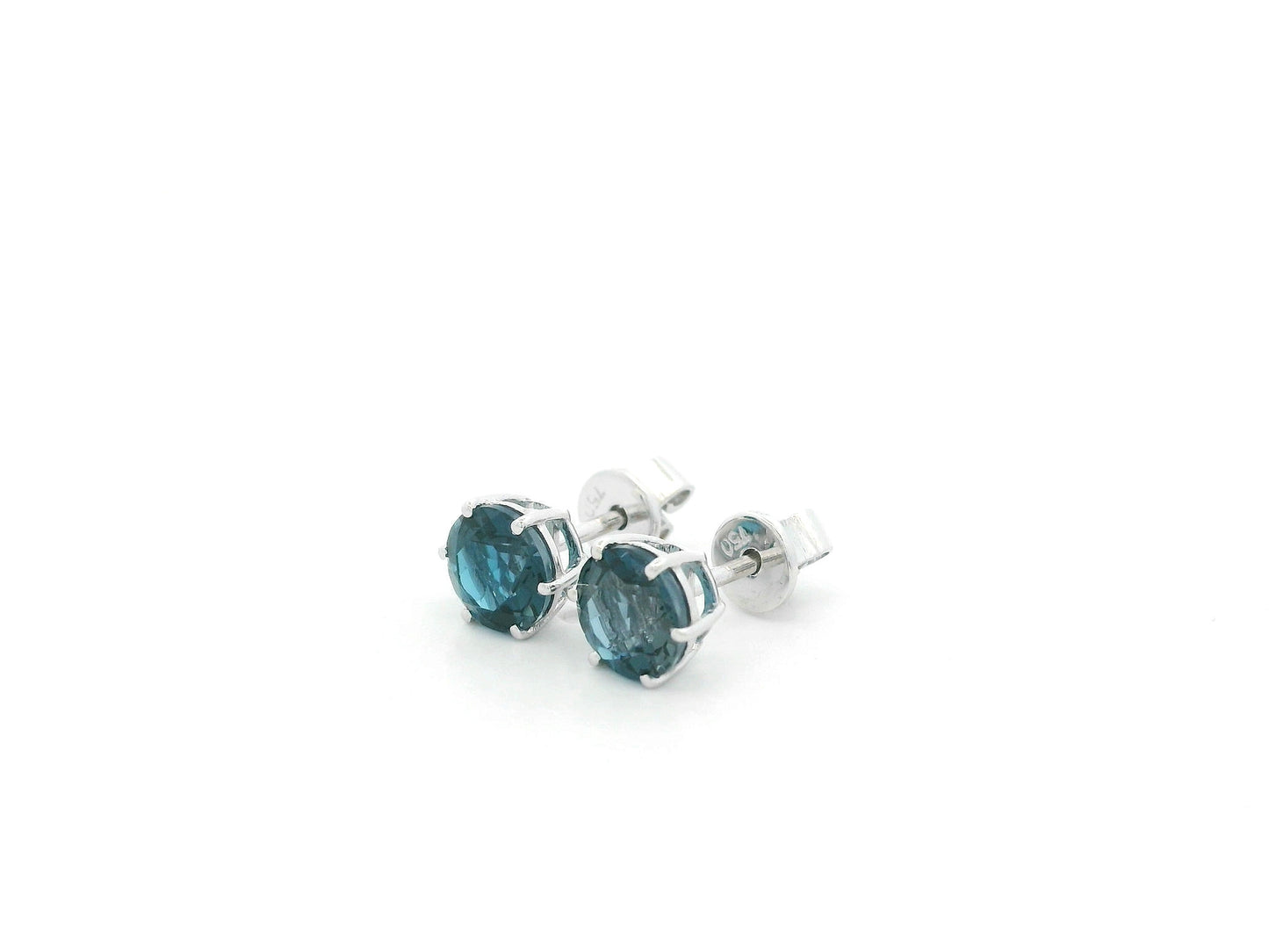 London Blue Topaz solitaire stud earrings in 18K white gold featuring 1.90 carats of natural round London Blue Topaz.