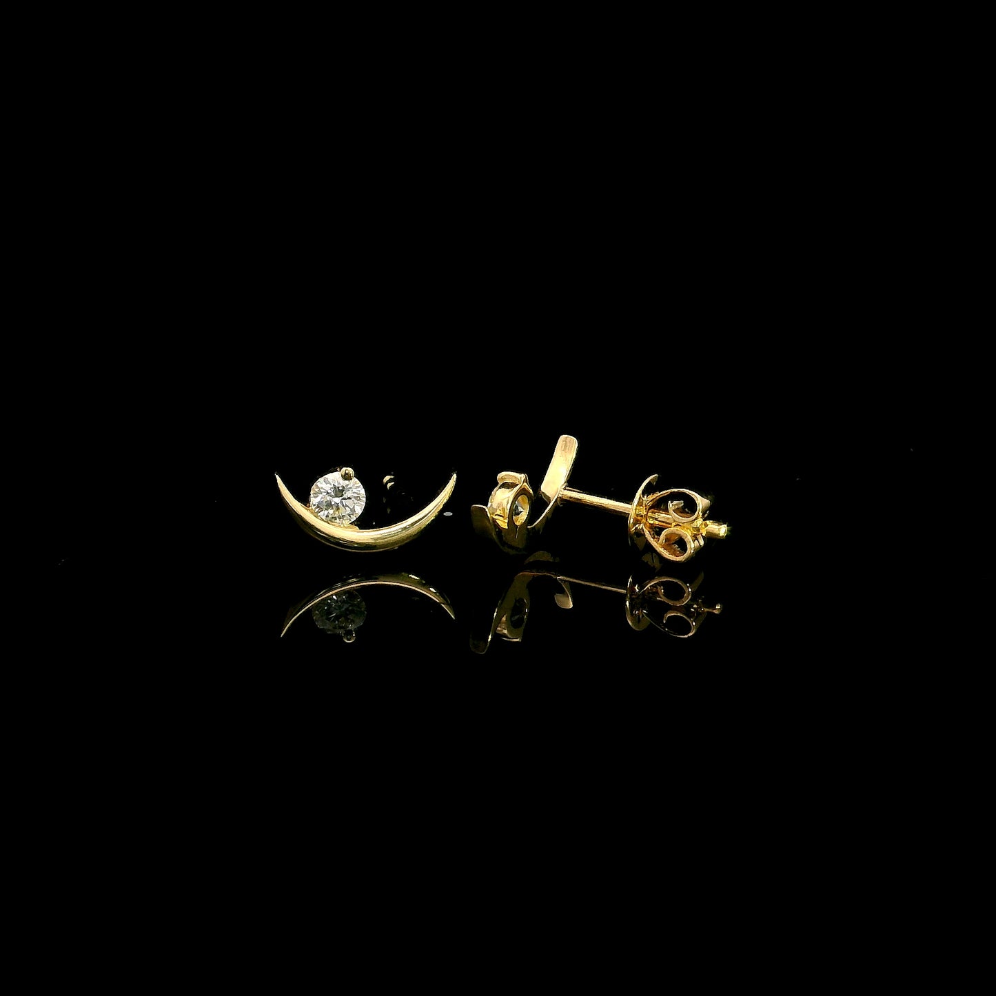 18K yellow gold crescent moon stud earrings featuring 0.17 carat natural round brilliant diamonds with secure butterfly push backs.