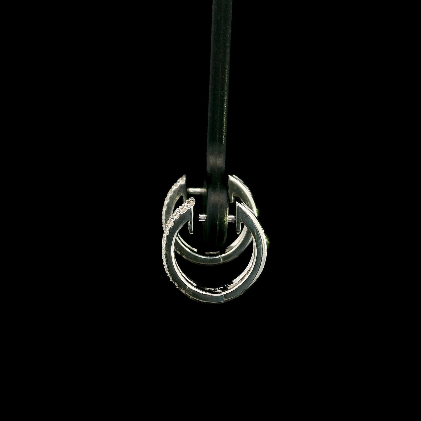 18K white gold diamond huggie hoop earrings featuring 0.23 carat natural round brilliant pavé-set diamonds in a modern double-row design with a secure hinged closure.