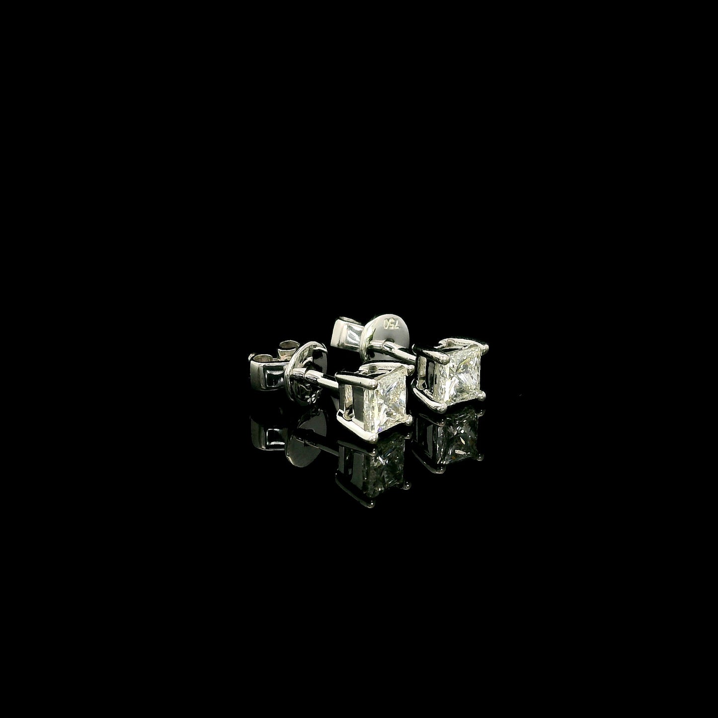 Princess cut diamond stud earrings in 18K white gold with 0.58 carat total natural diamond weight