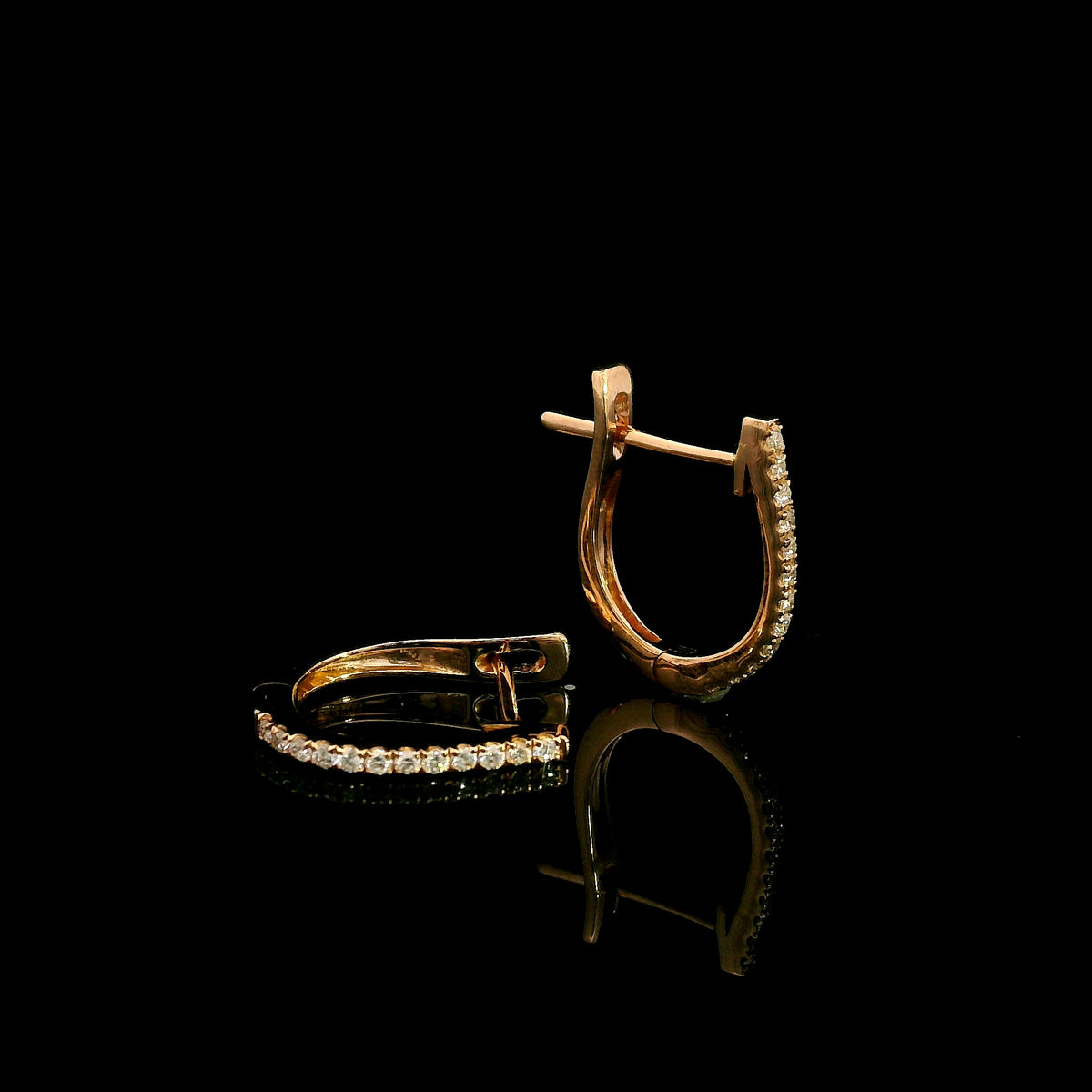Diamond hoop earrings in 18K rose gold with round diamonds and elongated design