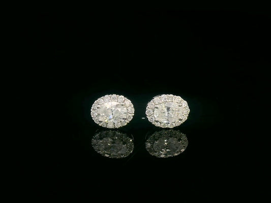 Oval diamond halo stud earrings in 18K white gold with 0.49 carats total diamond weight