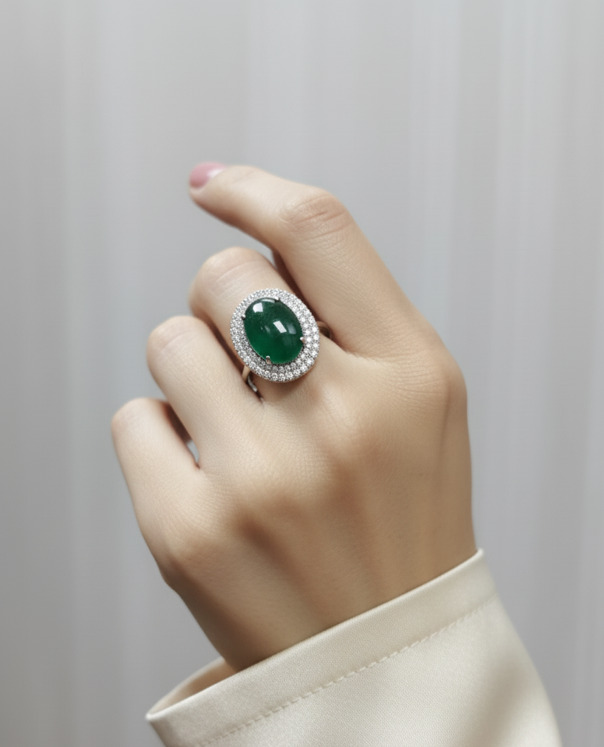 18K yellow gold cabochon emerald and diamond halo ring – 7.82ct emerald with 0.72ct diamonds by Emirates Diamonds