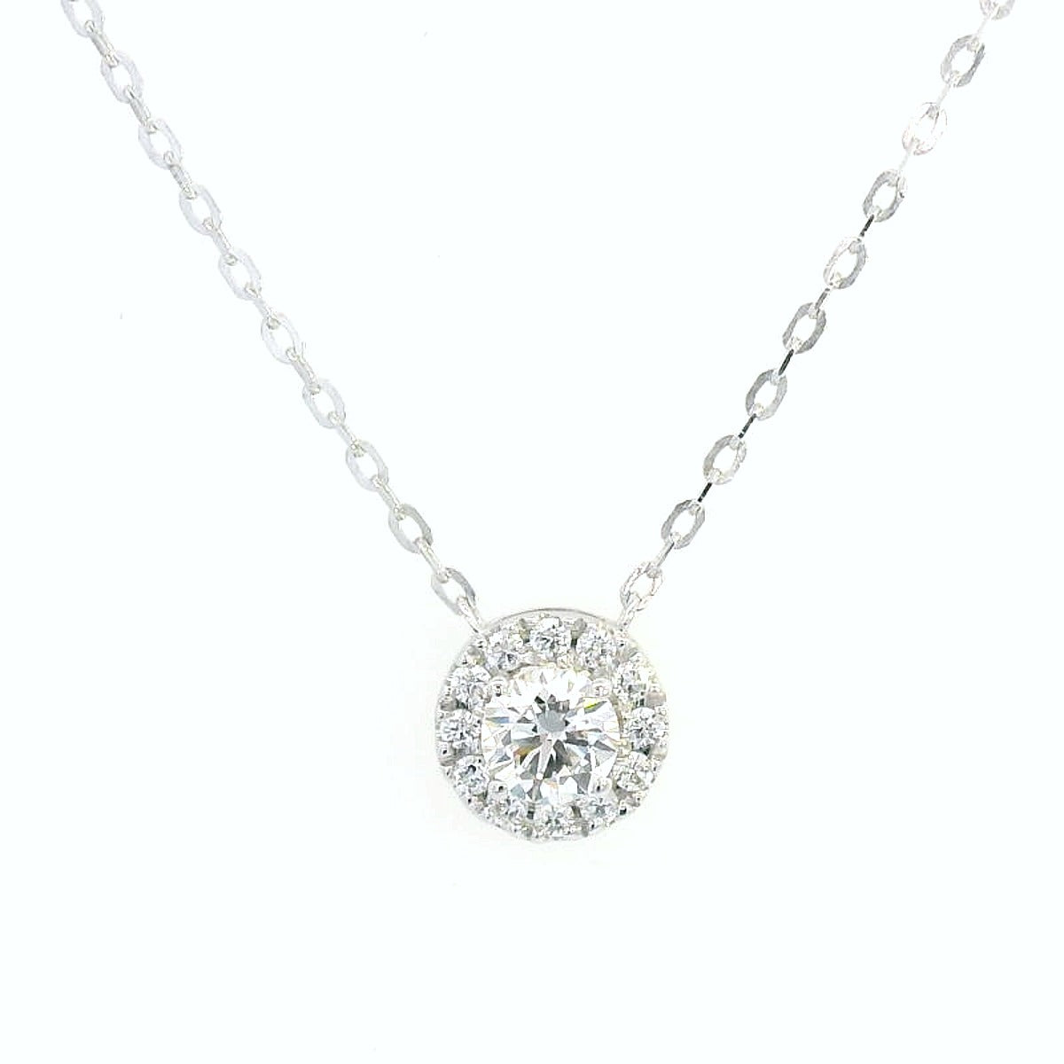 18K white gold diamond halo pendant necklace with 0.38ct round-cut center diamond and 0.21ct halo diamonds on white gold chain.