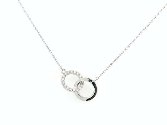 18K gold interlocking circles diamond pendant featuring 0.17 carat natural diamonds with a sleek polished gold circle. Chain not included; contact us for chain options.