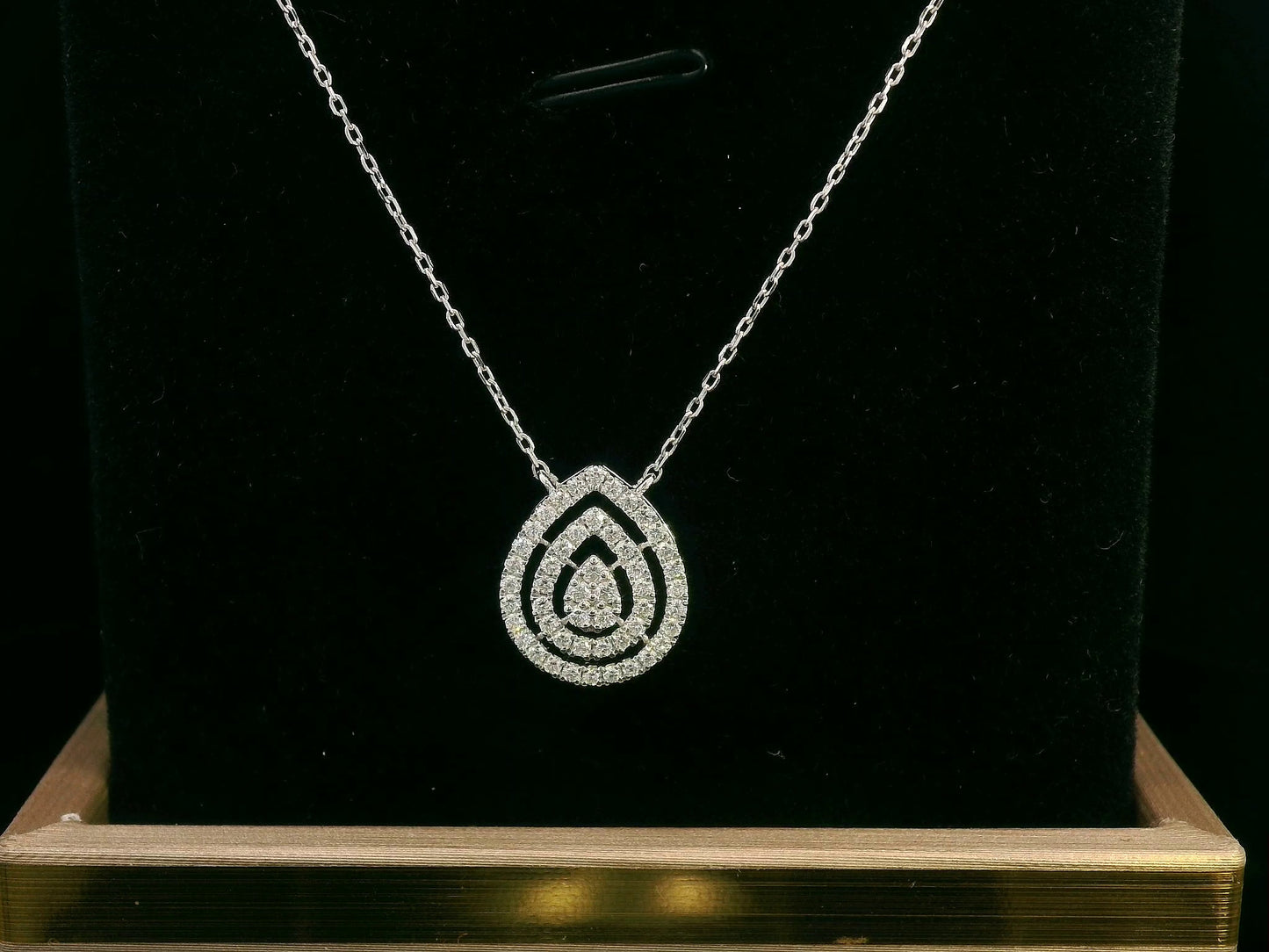 18K gold teardrop diamond halo pendant necklace with a 0.32ct natural diamond double-halo design, featuring an 18K gold chain.