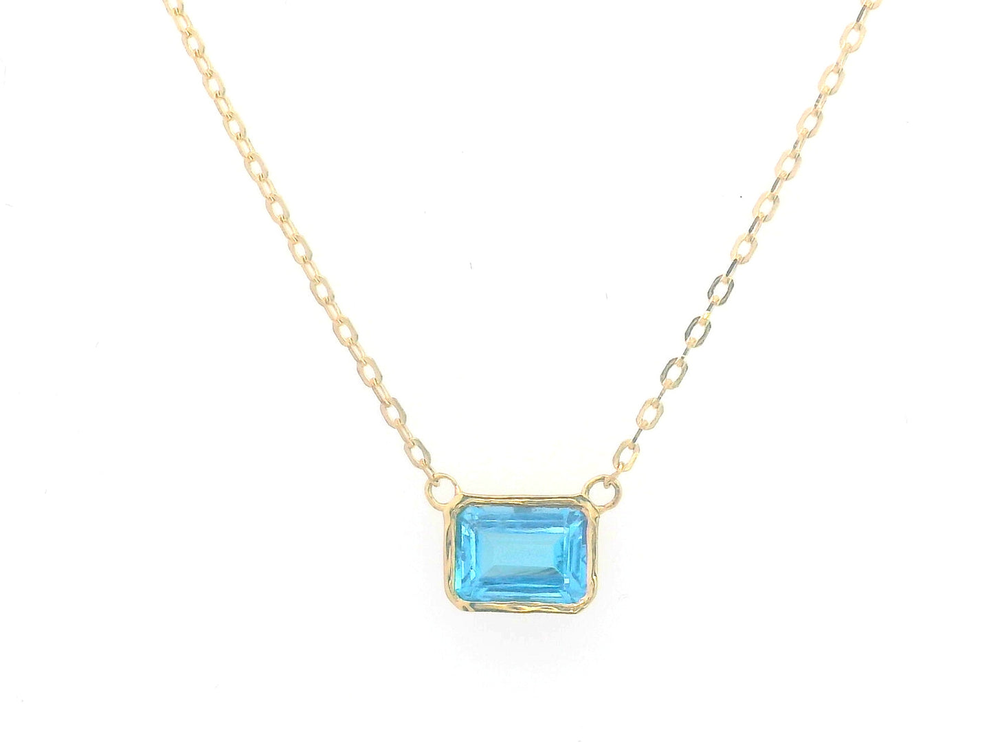 18K gold necklace with a bezel-set 1.17-carat emerald-cut London Blue Topaz, suspended from a fine gold chain for a minimalist, elegant look.
